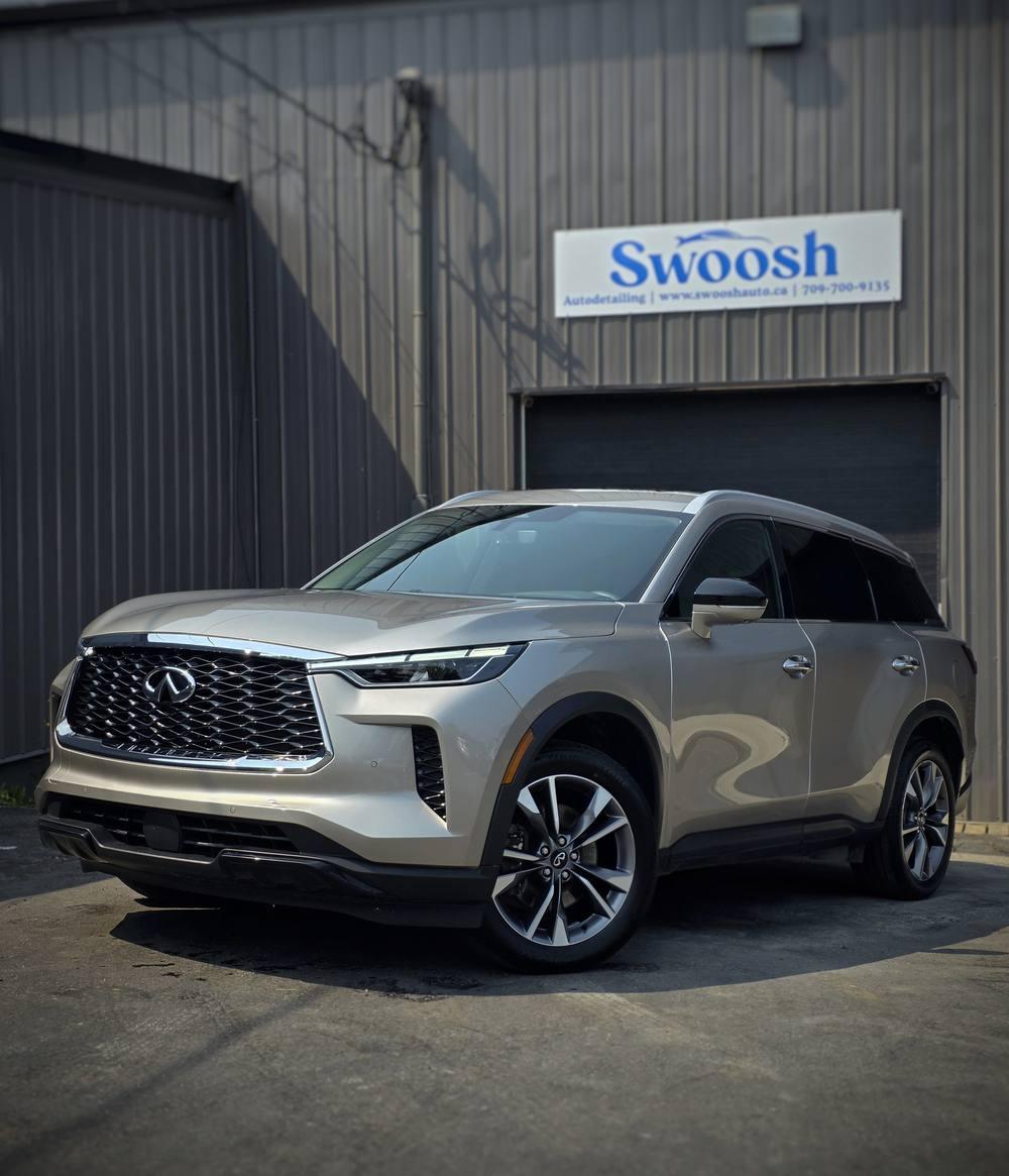 Infiniti QX60 SUV detailed by Swoosh Autodetailing, in front of the Swoosh shop